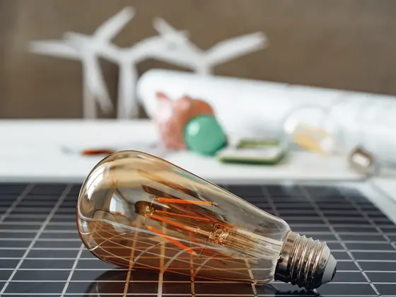 solar energy panel with light bulb representing green energy